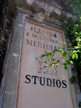 The Meridian Studioslogo hand painted on a historic stucco column at the entrance of the Meridian Studios in downtown Santa Barbara, California