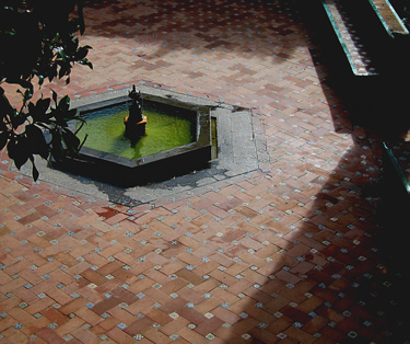 historic hexagon shaped fountain in a public plaza in Seville, Spain