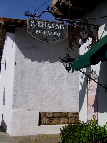 a quality wrought iron and wood sign for the Streets in Spain El Paseo in the historic downtown of Santa Barbara California